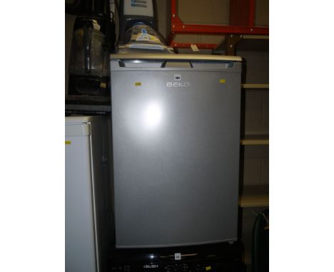 A silver coloured Beko under bench fridge.
