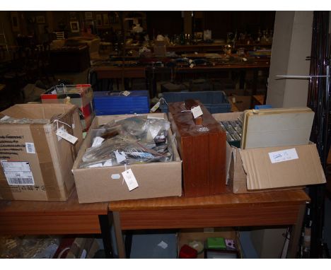 A large quantity of fly tying tools and materials, in four boxes; and a mahogany case, including three vices; Metz capes; too