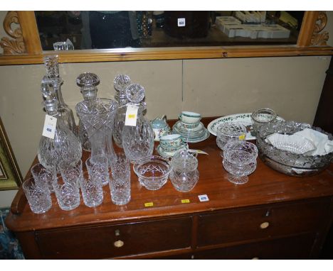 A Japanese florally decorated tea service; five crystal decanters; eight crystal tumblers; and other glassware.