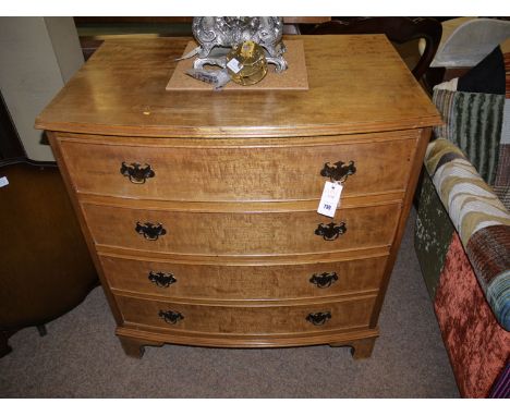 A faded reproduction mahogany bowfront chest of four drawers, raised on bracket feet.