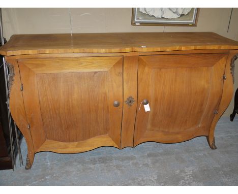 A Continental style fruitwood sideboard "Parisienne grande buffet de neuve", by Nathan.