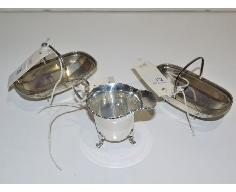 A pair of silver trug pattern bon-bon dishes, by James Deakin & Sons, Sheffield 1933; together with a cream jug, by C. & S. L