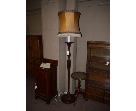 A mahogany standard lamp fitted with shade; together with a reproduction mahogany wine table.