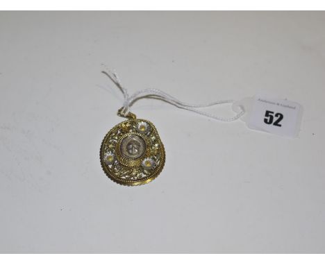 A yellow and white metal memorium pendant, centred by a cherub surround by bezel, engraved 'Philip Hugh 12 Feb 1886', surroun