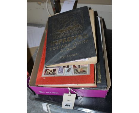 Three stamp albums; and a box of coins.