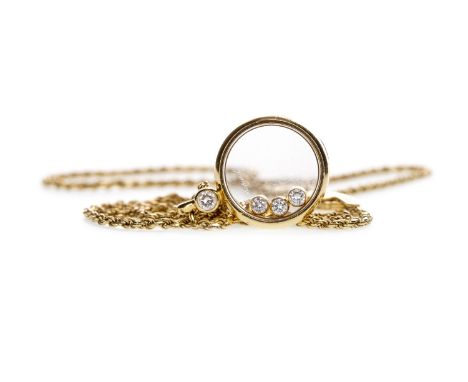 CHOPARD HAPPY DIAMONDS PENDANT, of circular form, 15mm wide and with transparent front and reverse, with three free-moving di
