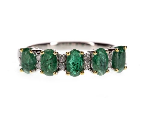 EMERALD AND DIAMOND RING, the oval emeralds interspaced by pairs of round brilliant cut diamonds totalling approximately 0.11