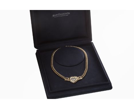 CHOPARD HAPPY DIAMONDS EIGHTEEN CARAT GOLD RUBY AND DIAMOND NECKLACE, with a central heart motifs with free-moving diamonds w