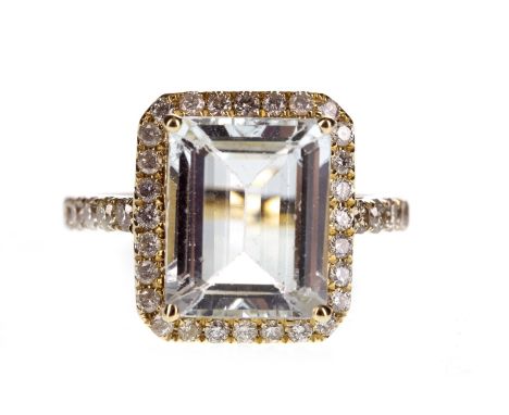 AQUAMARINE AND DIAMOND RING, the step cut aquamarine of approximately 3.48 carats within a round brilliant cut diamond halo, 