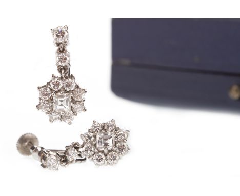 PAIR OF DIAMOND CLUSTER EARRINGS, each set with a central step cut diamond within a border of round brilliant cut diamonds, w