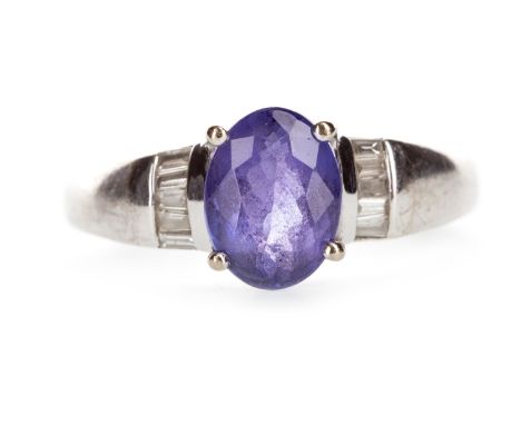 TANZANITE AND DIAMOND RING, set with a central oval faceted tanzanite 8.2mm long with accompanying Anchor Cert report BIR7826