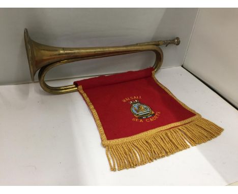 AN EDWARDIAN BRASS BUGLE WITH THE COLOURS OF THE WALSALL SEA CADETS 