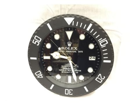 A BLACK DEALERS WALL CLOCK 