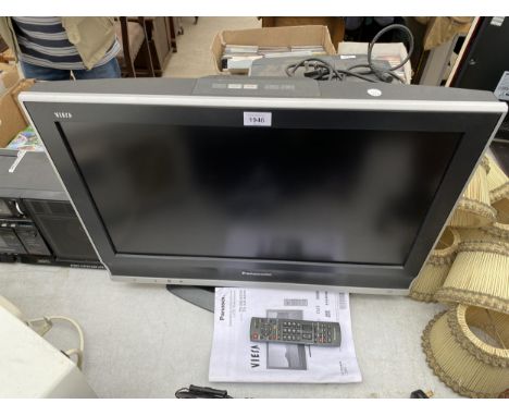 A PANASONIC 26" TELEVISION WITH REMOTE CONTROL AND INSTRUCTION MANUAL 