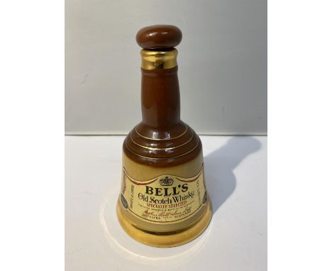 A 6 2/3 FLOZ WADE DECANTOR OF BELL'S SPECIALLY SELECTED 70% OLD SCOTCH WHISKY 