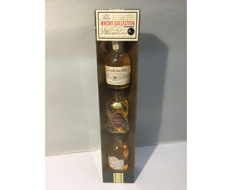 A GIFT BOX WITH THREE 5CL SINGLE MALT SCOTCH WHISKIES INSIDE TO INCLUDE GLENKINCHIE, CARDHU AND DALWHINNIE 