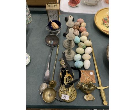 A QUANTITY OF COLLECTABLE ITEMS TO INCLUDE ONYX EGGS, HORSE BRASSES, A LARGE LADEL, CARRIAGE CLOCK, CANDLESTICKS, ETC 
