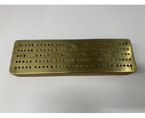 A BRASS TOPPED VINTAGE CRIBBAGE BOARD 
