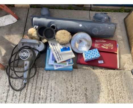 AN ASSORTMENT OF AUTOMOBILE ITEMS TO INCLUDE LIGHTS, MANUALS AND BUFFING PADS ETC 
