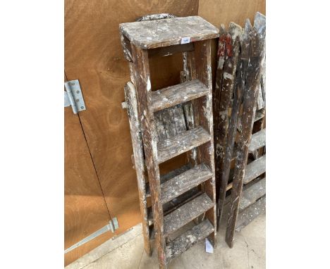 A VINTAGE FIVE RUNG WOODEN STEP LADDER AND A VINTAGE THREE RUNG WOODEN STEP LADDER 