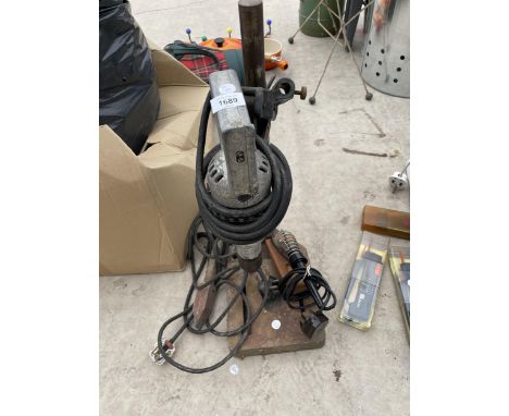 A WOLF DRILL STAND AND A DRILL 