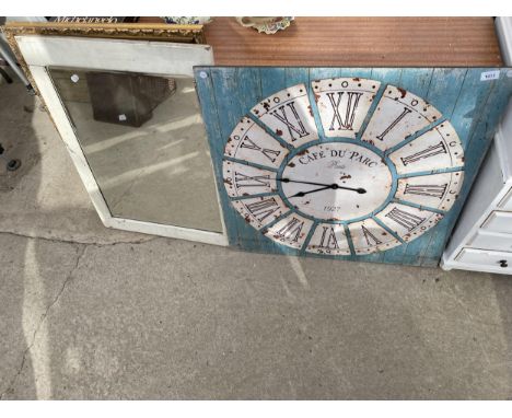 A DECORATIVE WALL CLOCK AND TWO FRAMED MIRRORS 