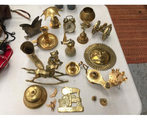 A LARGE QUANTITY OF BRASSWARE TO INCLUDE CANNON, ROCKING HORSE, CANDLESTICK WITH SNUFFER, COUNTER BELL, ETC 