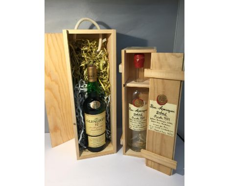 A 70CL BOTTLE OF THE GLENLIVET AGED 12 YEARS PURE SINGLE MALT SCOTCH WHISKY 40% VOL IN A WOODEN BOX AND AN EMPTY BOTTLE OF BA