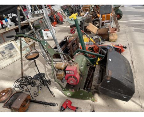 A VINTAGE WEBB PETROL ENGINE LAWN MOWER WITH GRASS BOX BELIEVED IN WORKING ORDER BUT NO WARRANTY 