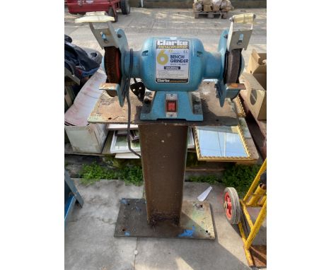 A CLARKE 6" BENCH GRINDER AND A METAL STAND 