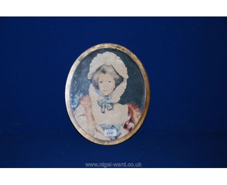 An oval Watercolour portrait of a 19th c. lady in a bonnet, with Aitken and Dott, Edinburgh label verso.