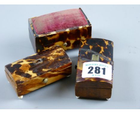 Three oblong tortoiseshell miniature 'chest' boxes, one with pin cushion top to the lid