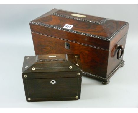 A Regency rosewood sarcophagus shaped tea caddy with mother of pearl escutcheon, turned ring carry handled and egg and dart s