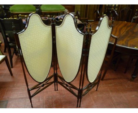 An excellent quality three fold rosewood dressing screen with shield shaped floral upholstered panels and carved finial decor