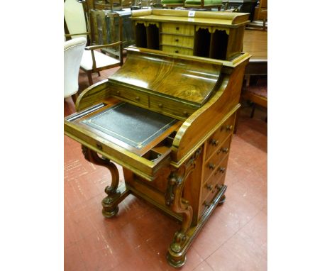 A super quality walnut Victorian piano top Davenport with patent pop-up top rising to reveal a central bank of drawers and pi