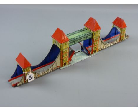 A Technofix tinplate model of Tower Bridge, London, marked 'Made in US Zone, Germany', 15 x 56 cms