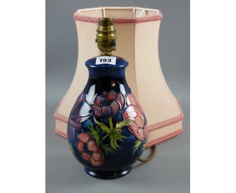 A Moorcroft pottery 'Clematis' lamp base, cobalt blue ground with painted and impressed factory marks beneath with pink lamps