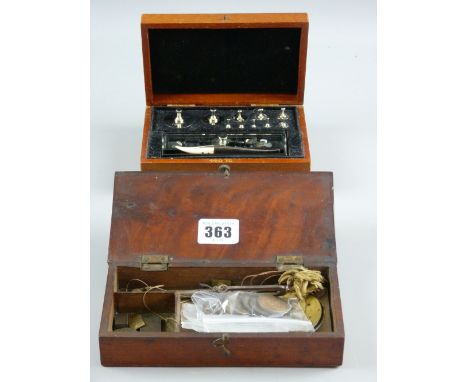 A mahogany cased set of balance scales and a chromium set of weights for precious metals with ivory tipped tweezers in a maho