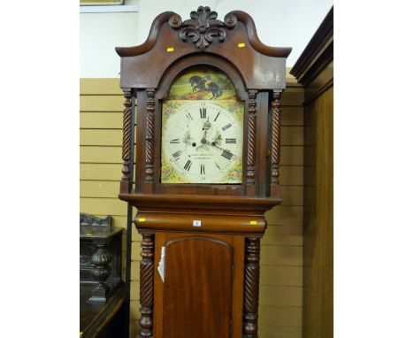 A Victorian mahogany longcase clock, the hood with broken swan neck pediment and central carved swag above an arched door wit