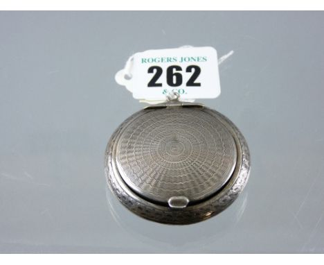 An engine turned silver lidded powder compact with mirror to lid, 0.8 ozs gross, Birmingham 1916