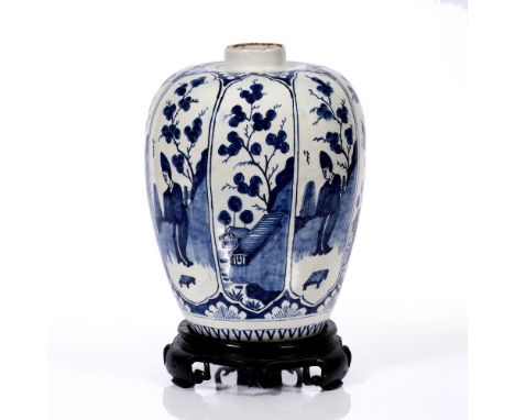 Large Delft vase circa 1800, decorated in the Chinese Kangxi style with panels of figures and buildings on a Chinese hard woo