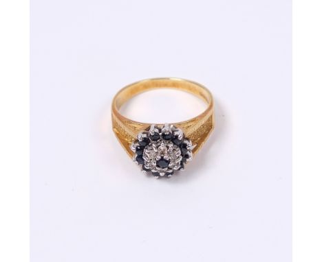 18ct gold ring with sapphire and cluster setting