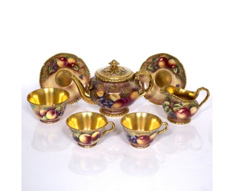 Three piece Royal Worcester teaset painted with fruit, the teapot signed by Stanley, milk jug signed by Skerrett and the suga