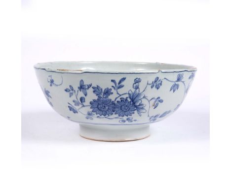 Delftware blue and white bowl circa 1800, with simple foliate decoration, 23cm diameter