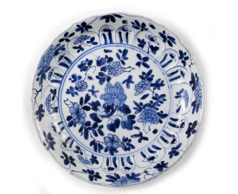 Blue and white lobed dish Chinese, Kangxi (1662-1722) central foliate design within a shaped border, conch shell mark in unde