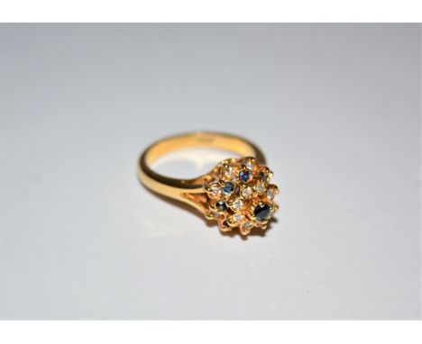 18ct gold ring with sapphire and diamond setting