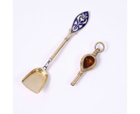 Gilt white metal trowel with inlaid enamel decoration, stamped 925 and a 19th Century watch key