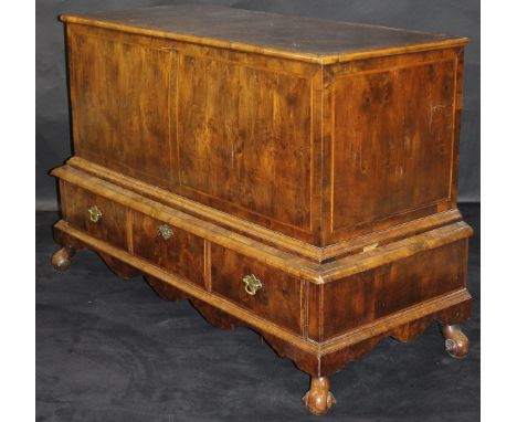 An 18th Century yew wood veneered and feather-banded mule chest, the upper section with rising lid and applied moulded edge o