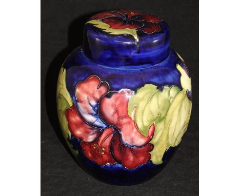 A 20th Century Moorcroft ginger jar of ovoid form decorated with pansies on a cobalt blue ground, bears sticker to the base "