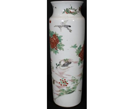 A Chinese white ground cylindrical vase in famille rose palette decorated with assorted birds set within a naturalistic setti